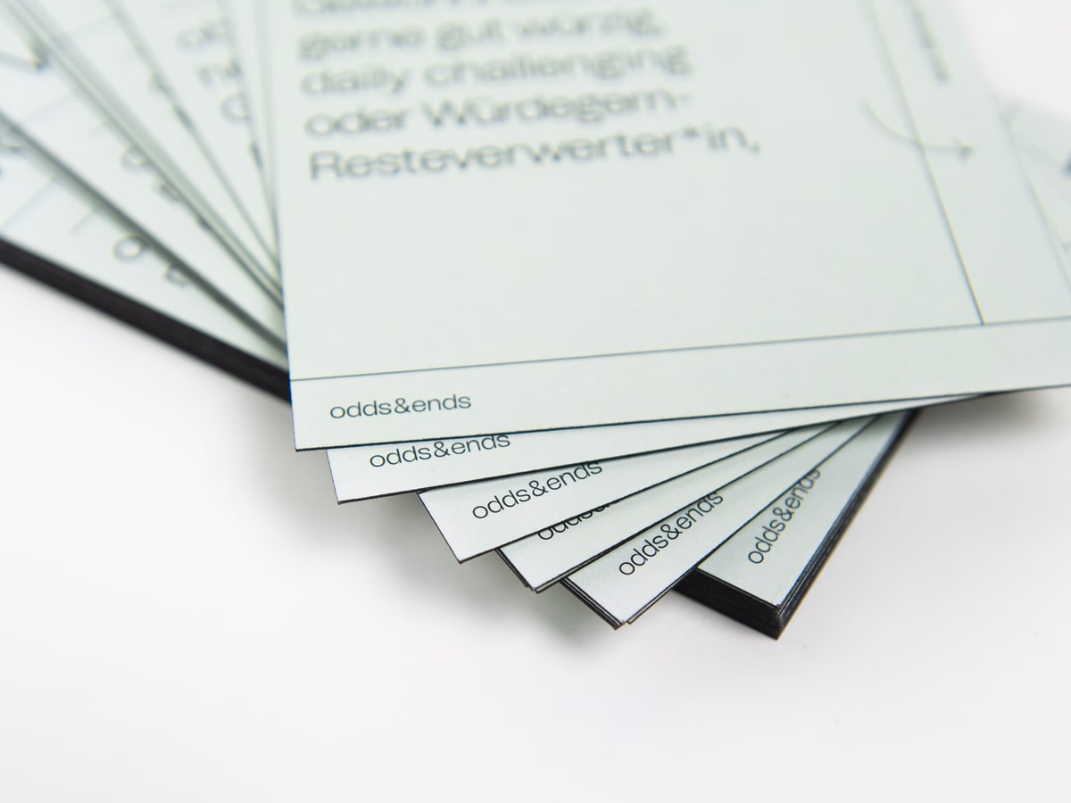 Stack of sage-green postcards featuring recipes and anti-food-waste tips.