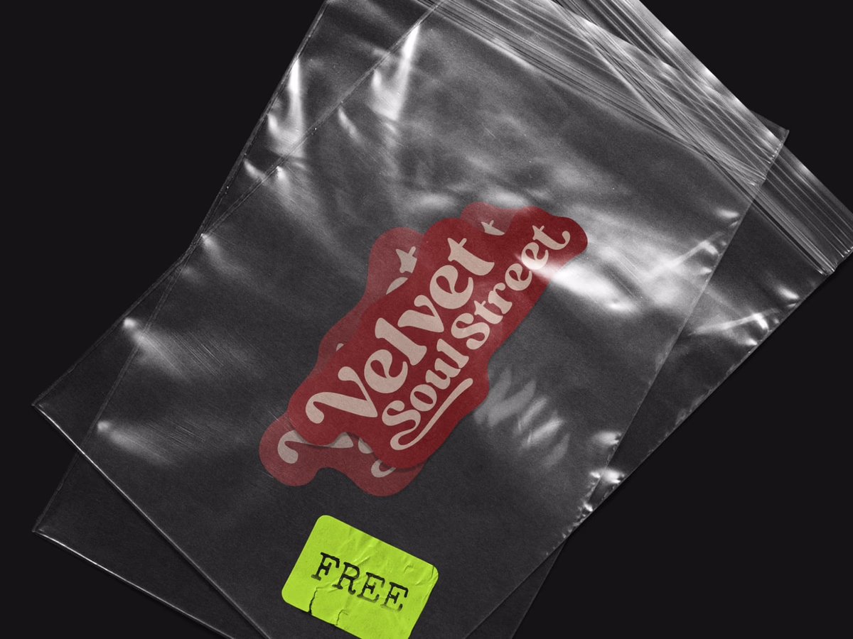 Transparent zip bag printed with the Velvet Soul Street wordmark and a bright-green FREE sticker.