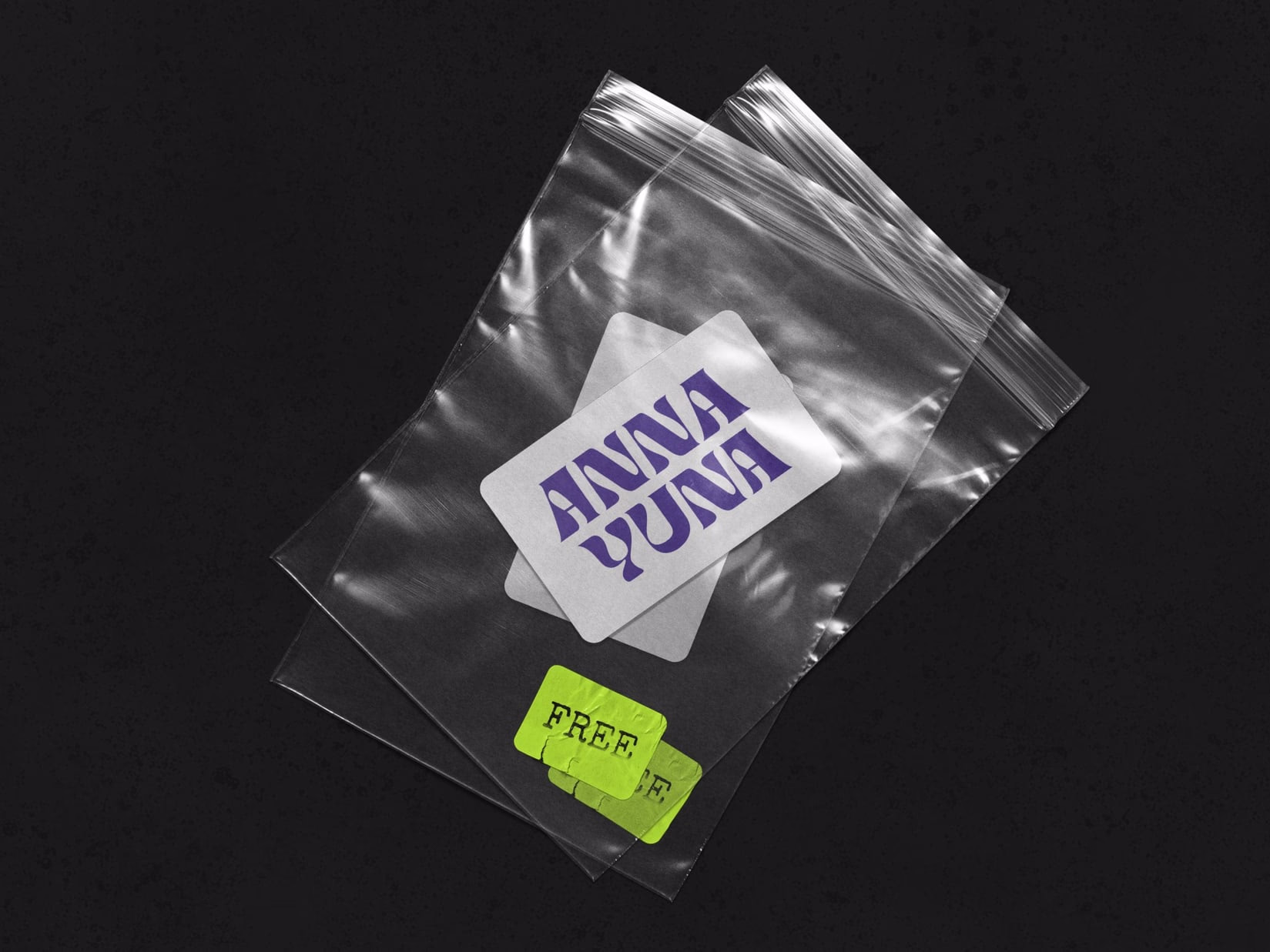 Transparent mailer bag printed with "ANNA YUNA" and tagged with a neon-yellow PREE label.